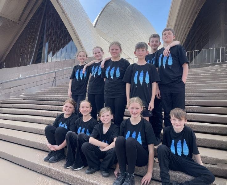 Eleven students on the front steps of the Sydney Opera House